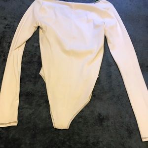 white body suit with black around edges